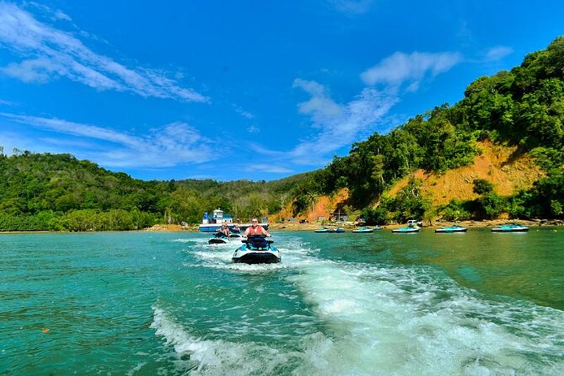 Group of adventurous jetski riders cruising through the beautiful waters of Phuket.
