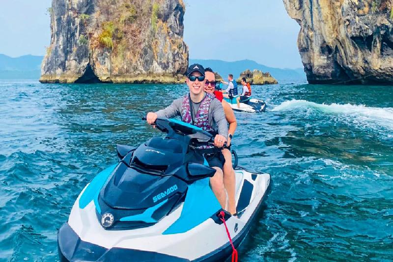 Watch the sunset from a jetski while riding through the calm waters of Phuket.