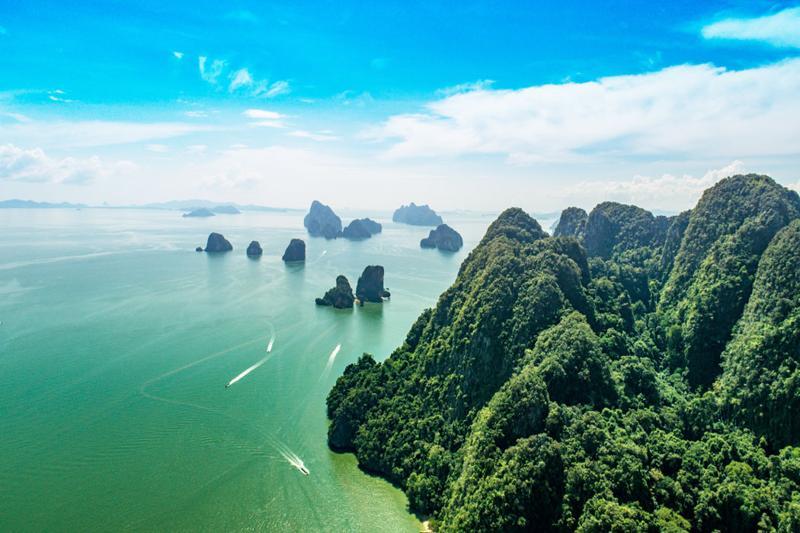 Discover the stunning view of Koh Hong Island with crystal-clear waters and towering cliffs, perfect