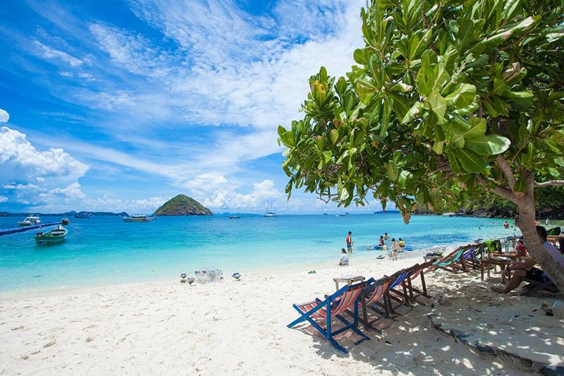 A tour of Racha and Coral Islands from Phuket, showcasing pristine beaches, turquoise waters, and a 