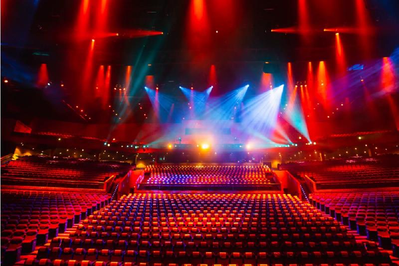 The Phuket Fantasea theater filled with vibrant lights during a spectacular stage performance.
